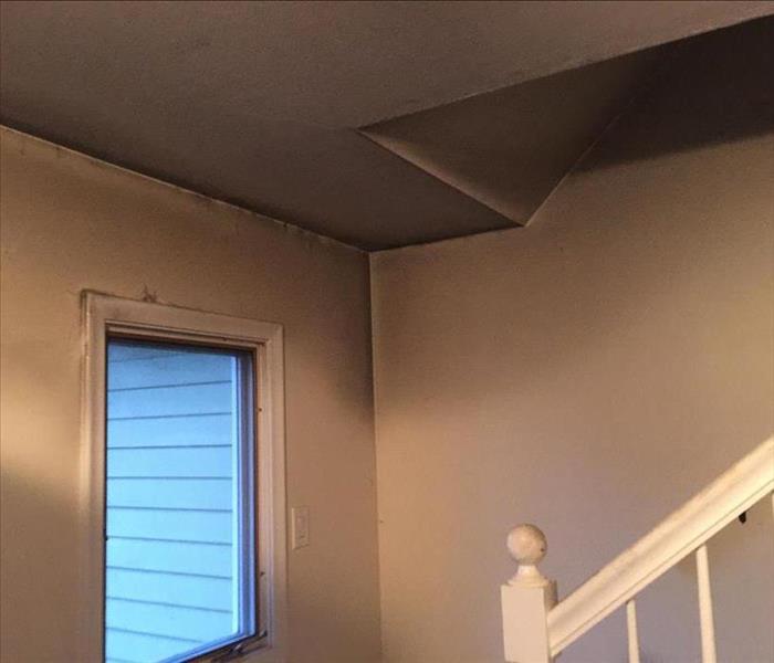Ceiling and stairs damaged by fire